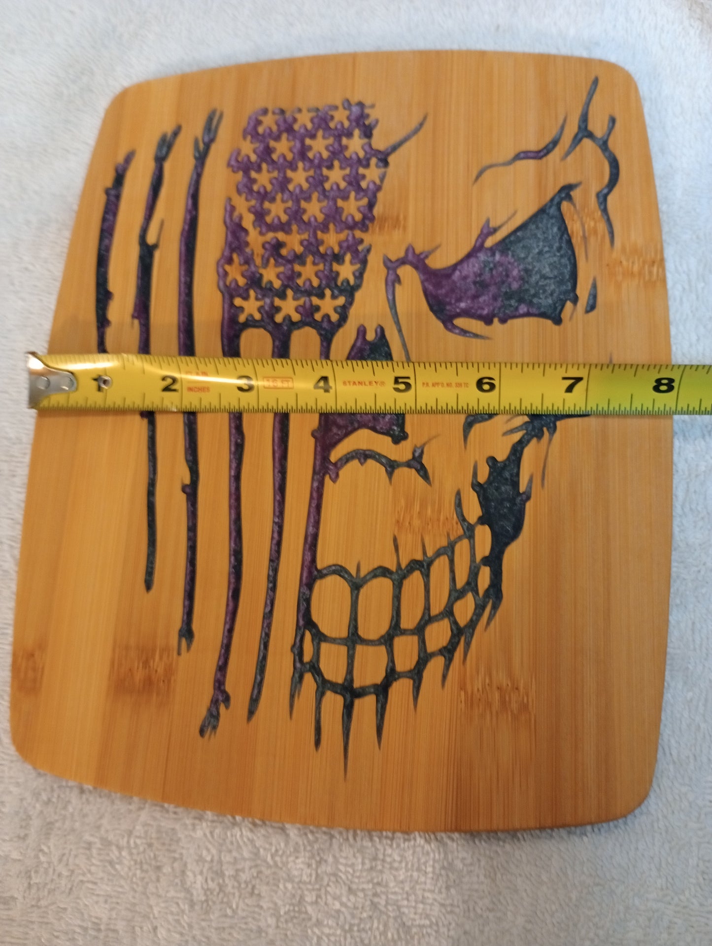 Bamboo cutting board with food grade epoxy inlays - skull flag