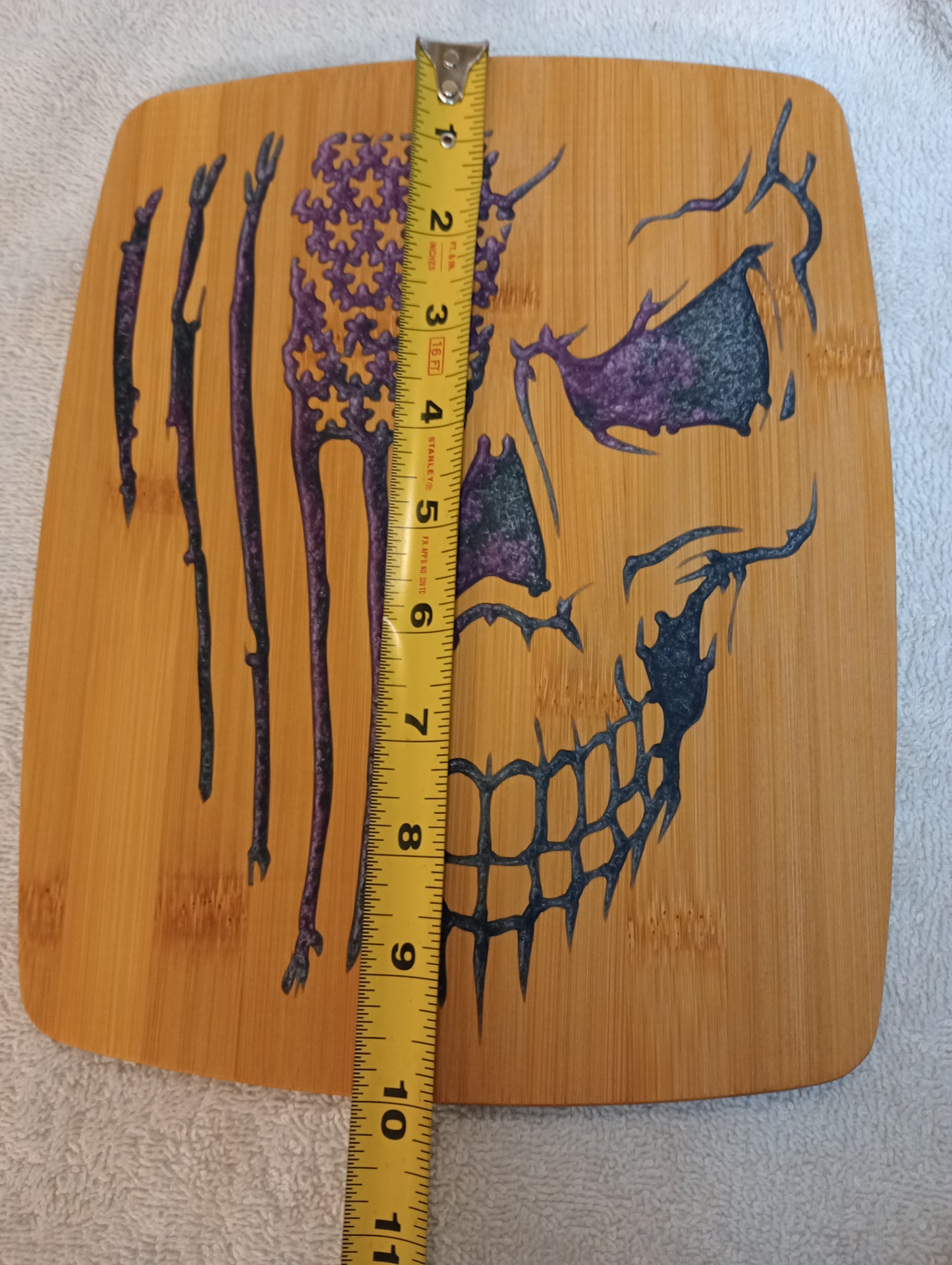 Bamboo cutting board with food grade epoxy inlays - skull flag