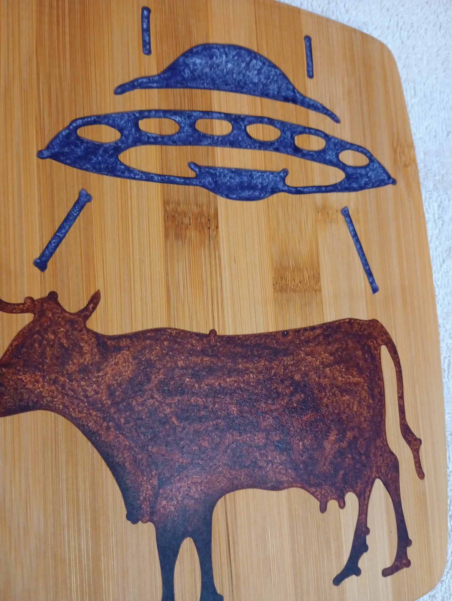 Bamboo cutting board with food grade epoxy inlays - cow abduction