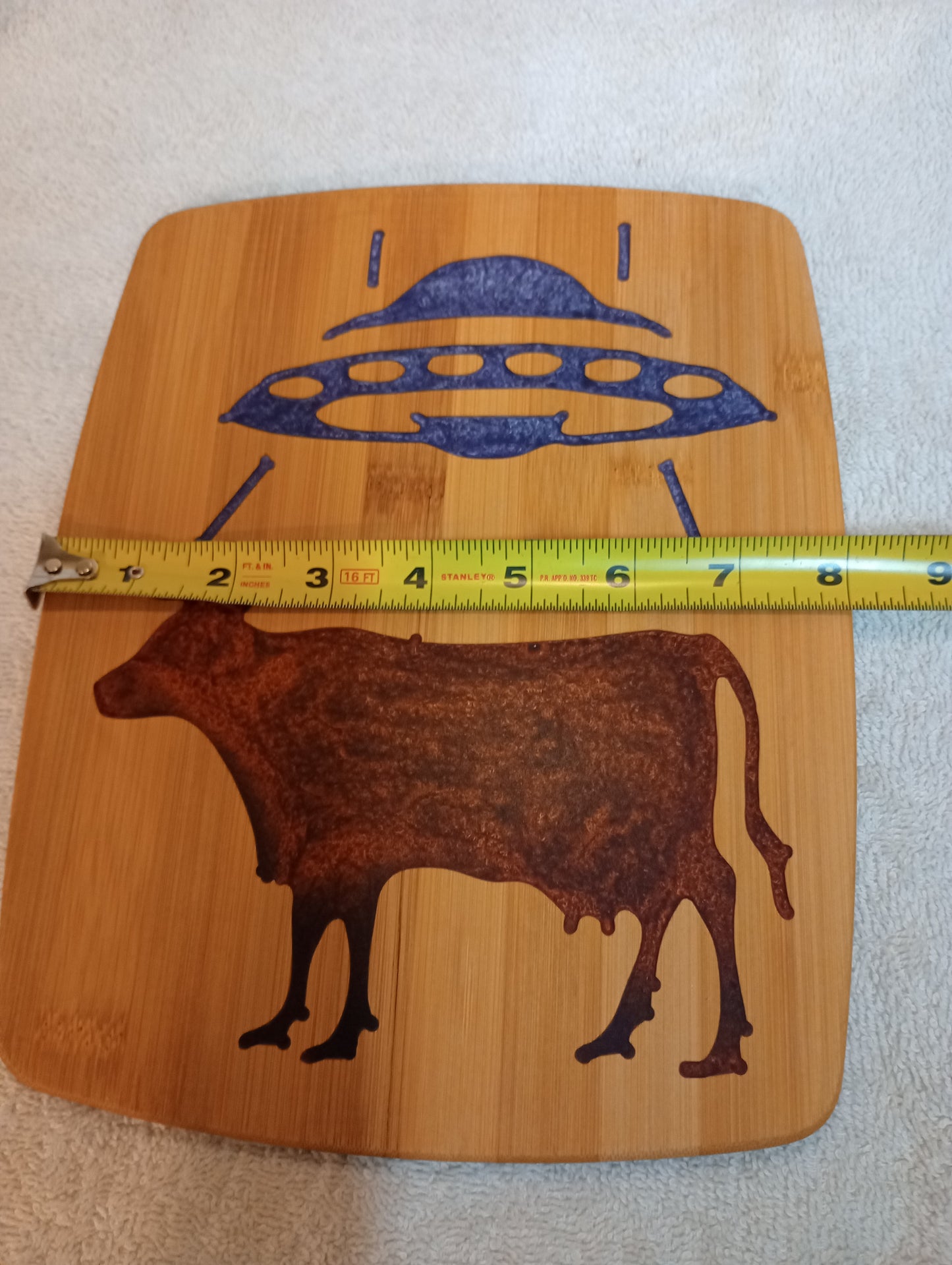 Bamboo cutting board with food grade epoxy inlays - cow abduction